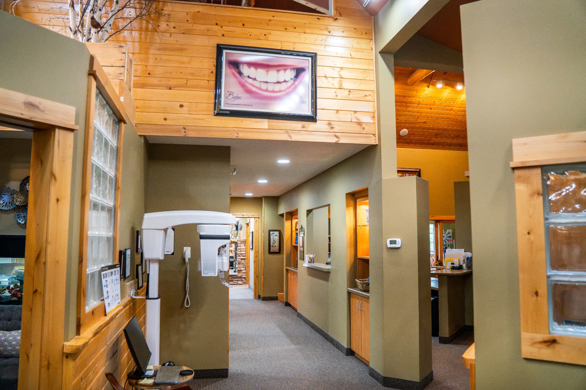 Hallway connecting the two lobbies - north entrance and the stair down at the far end, west lobby to the right