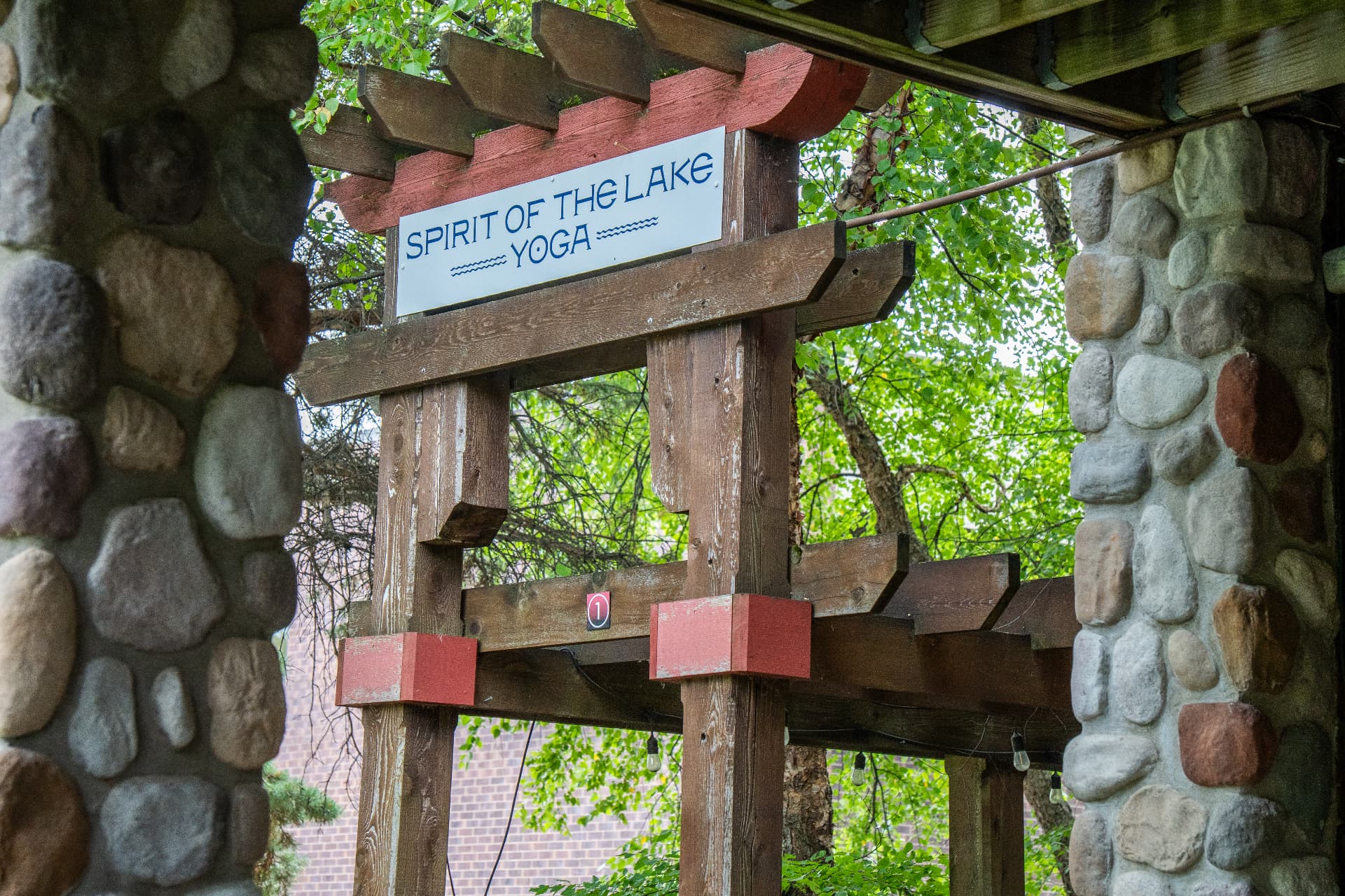 Spirit of the Lake Yoga pergola sign